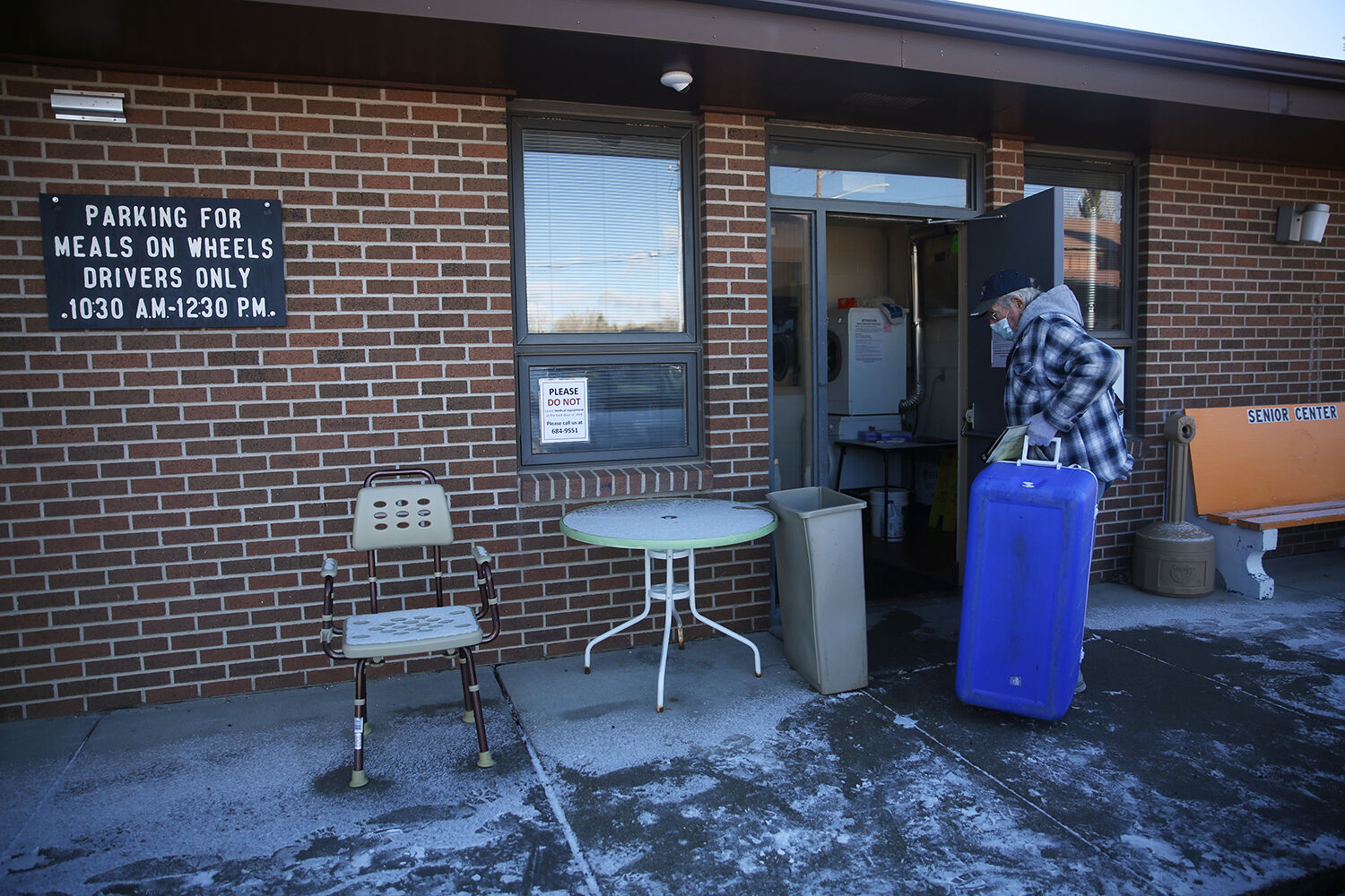 Leo Sampson hauls a cooler back into the senior center